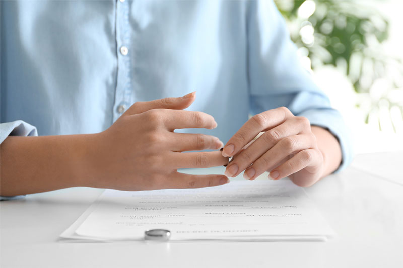 Person removing wedding ring