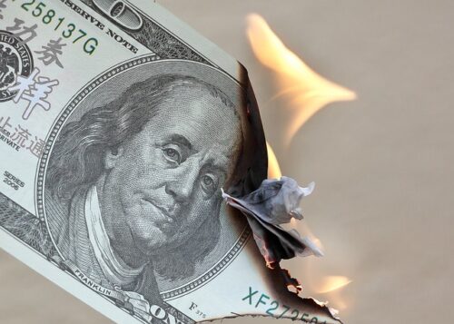 burning one hundred dollar bill