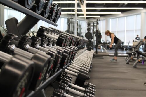 rack of dumbbell weights in a gym