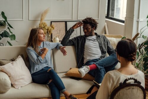 couple talking on couch