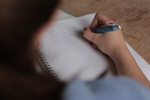 woman writing in notebook
